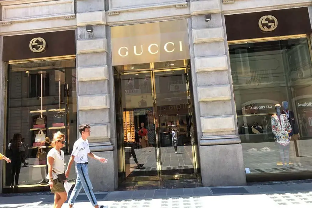 Gucci store with a golden sign and showcases